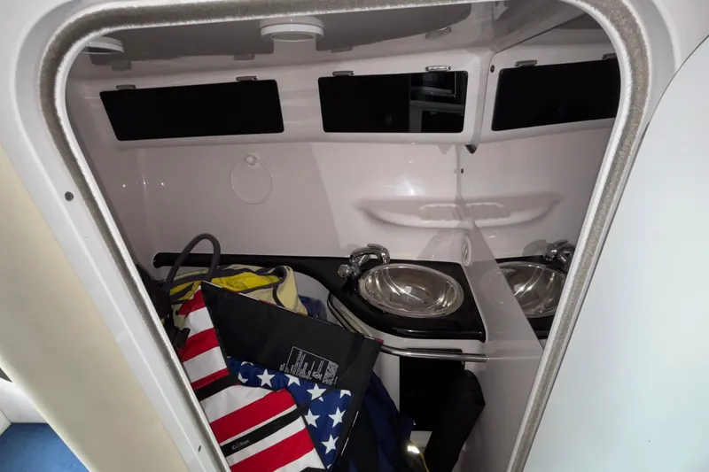  Yacht Photos Pics Interior of a 2002 Donzi 45 ZX boat with sink and storage area.