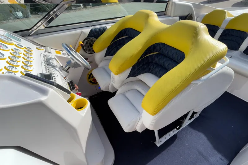  Yacht Photos Pics 2002 Donzi 45 ZX boat interior with yellow and white seating, detailed dashboard controls.