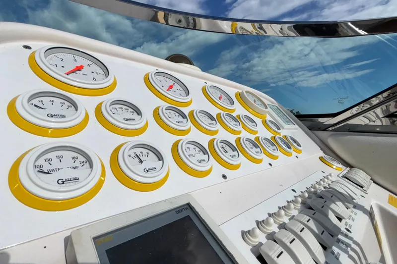  Yacht Photos Pics Dashboard of a 2002 Donzi 45 ZX boat with multiple gauges and controls.