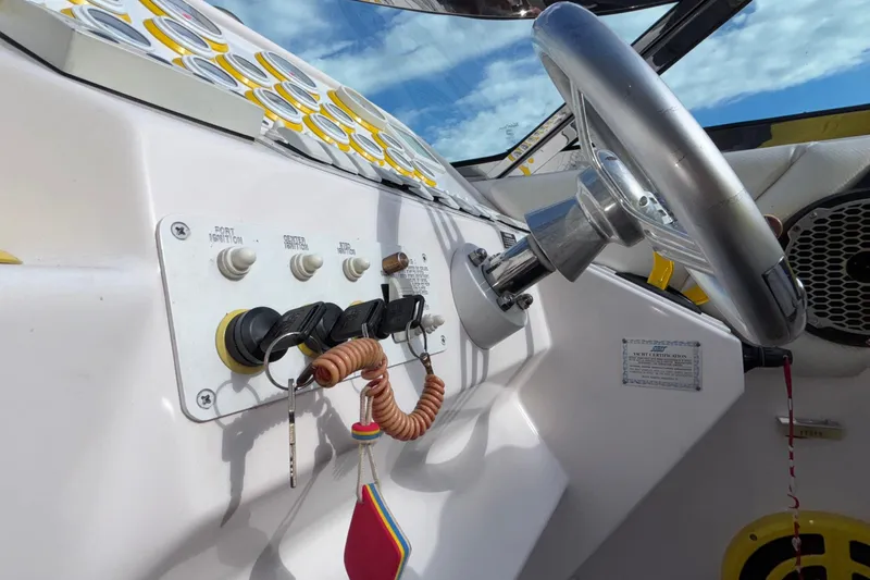  Yacht Photos Pics 2002 Donzi 45 ZX boat dashboard with steering wheel and ignition switches.