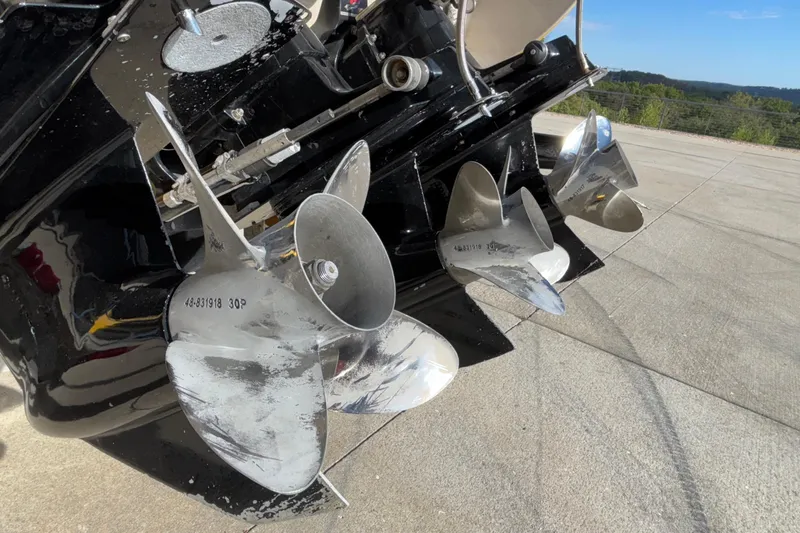  Yacht Photos Pics Propellers of a 2002 Donzi 45 ZX boat on a concrete surface.