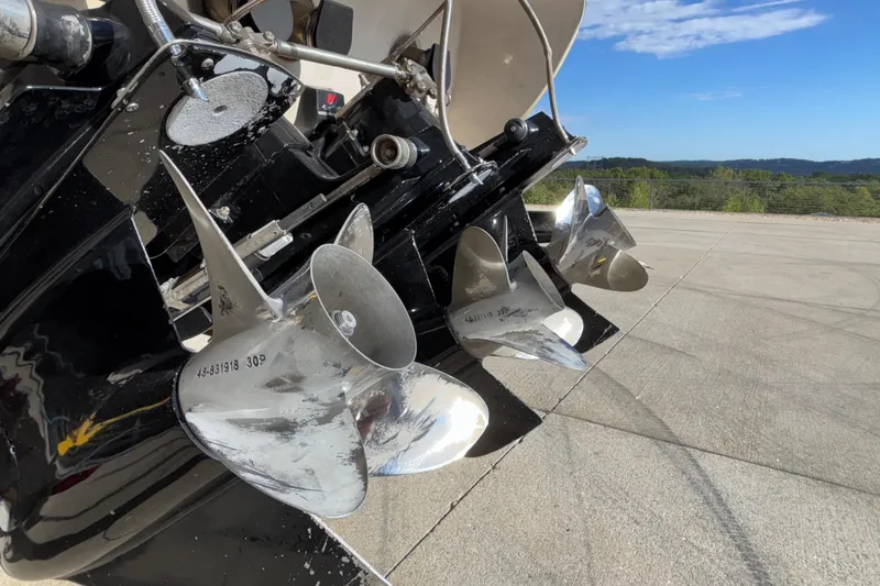  Yacht Photos Pics Close-up of 2002 Donzi 45 ZX boat propellers on a sunny day.