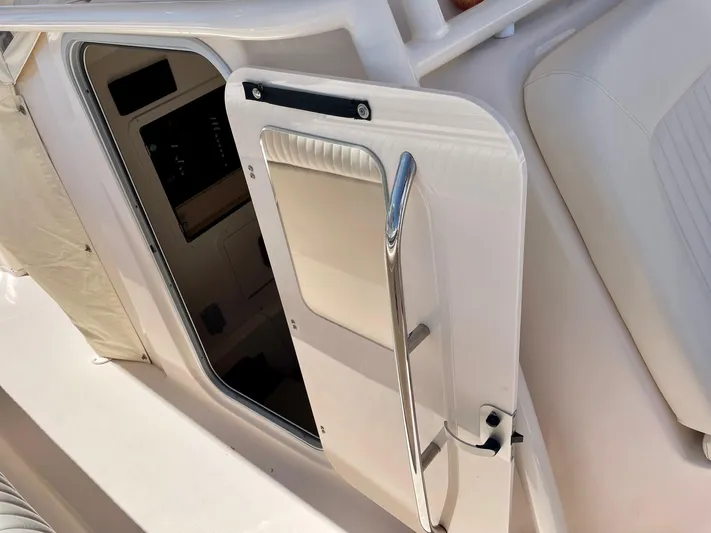  Yacht Photos Pics 2012 Grady-White Canyon 336 boat cabin door, open with visible interior.