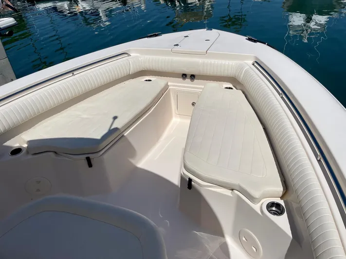  Yacht Photos Pics 2012 Grady-White Canyon 336 boat interior with cushioned seating and storage.