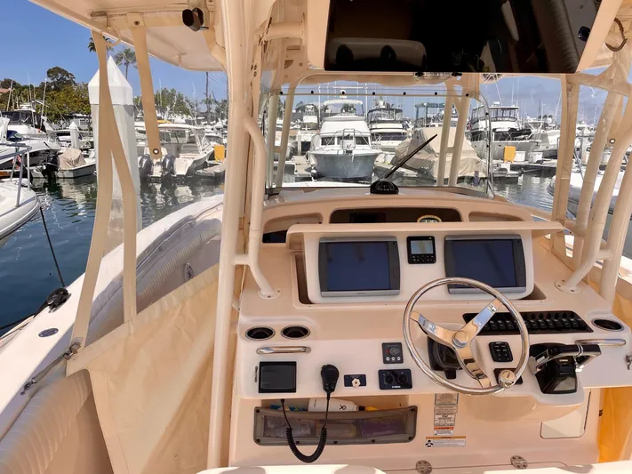  Yacht Photos Pics 2012 Grady-White Canyon 336 boat dashboard with marina view in the background.