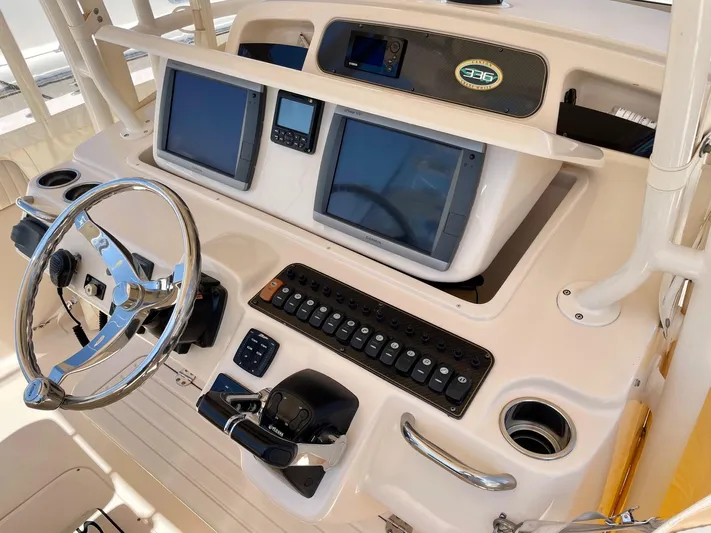  Yacht Photos Pics 2012 Grady-White Canyon 336 boat dashboard with dual screens and control panel.