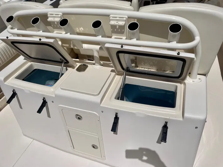  Yacht Photos Pics 2012 Grady-White Canyon 336 fishing station with rod holders and storage compartments.