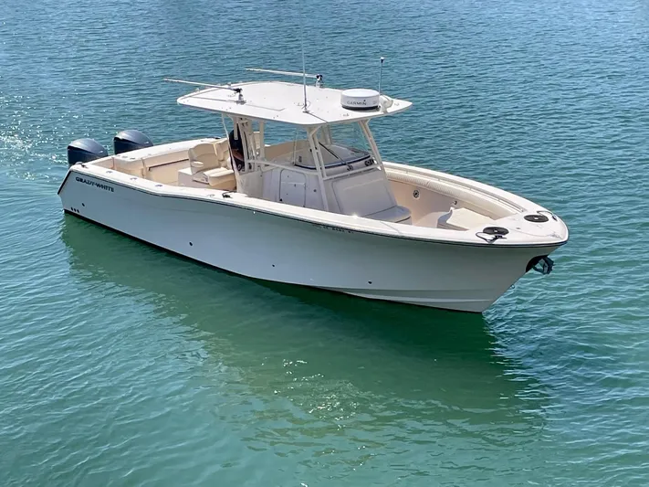  Yacht Photos Pics 2012 Grady-White Canyon 336 boat on clear blue water.
