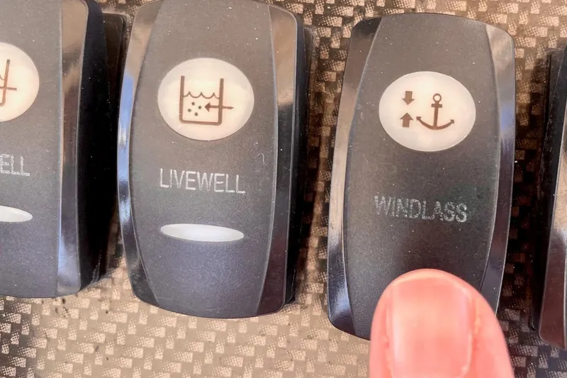  Yacht Photos Pics Switches on a 2012 Grady-White Canyon 336 boat dashboard for livewell and windlass.