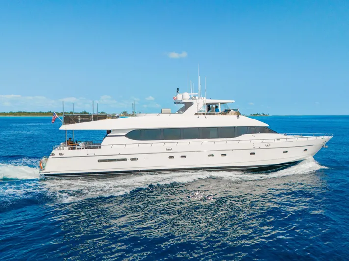 Two Seas Yacht Photos Pics 2001 Hargrave Flybridge yacht cruising on open blue sea under clear sky.