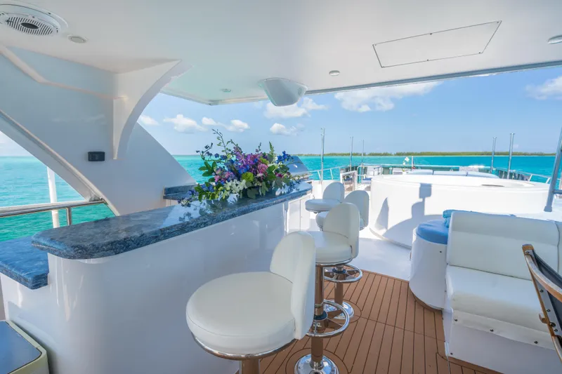 Two Seas Yacht Photos Pics Luxurious 2001 Hargrave Flybridge yacht with elegant seating and ocean view.