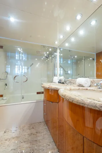 Two Seas Yacht Photos Pics Luxurious bathroom in 2001 Hargrave Flybridge yacht with marble countertops and glass shower.