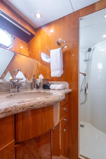 Two Seas Yacht Photos Pics Luxurious bathroom in 2001 Hargrave Flybridge yacht with marble countertop and modern shower.