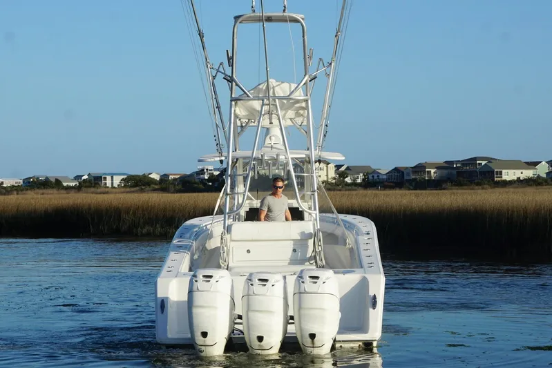  Yacht Photos Pics 2017 SeaHunter 35 Tournament boat with triple engines on calm water.