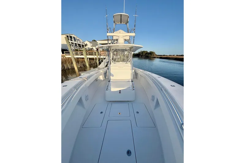  Yacht Photos Pics 2017 SeaHunter 35 Tournament boat on calm water, showcasing spacious deck and sleek design.