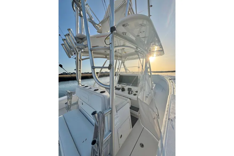  Yacht Photos Pics 2017 SeaHunter 35 Tournament boat interior with sunset view, featuring helm and seating.