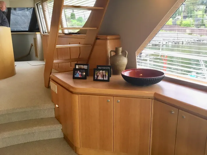 "southern Cross" Yacht Photos Pics Interior of 1998 West Bay Sonship yacht with wooden cabinetry and decorative items.
