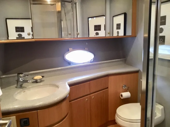 "southern Cross" Yacht Photos Pics Luxurious bathroom in 1998 West Bay Sonship yacht with modern fixtures and elegant cabinetry.