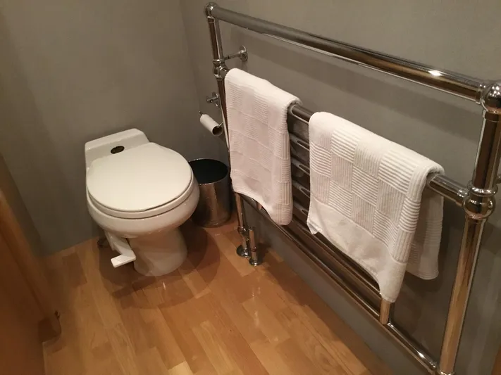 "southern Cross" Yacht Photos Pics Bathroom in 1998 West Bay Sonship yacht with toilet and towel rack.