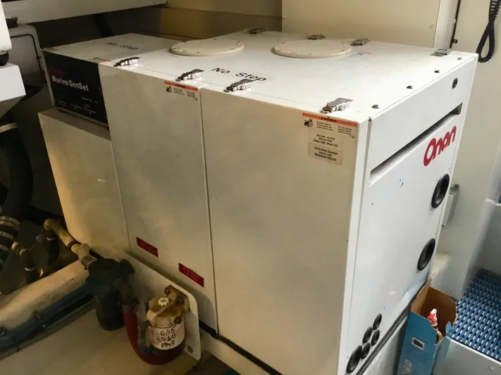 "southern Cross" Yacht Photos Pics Onan marine generator in a 1998 West Bay Sonship yacht engine room.