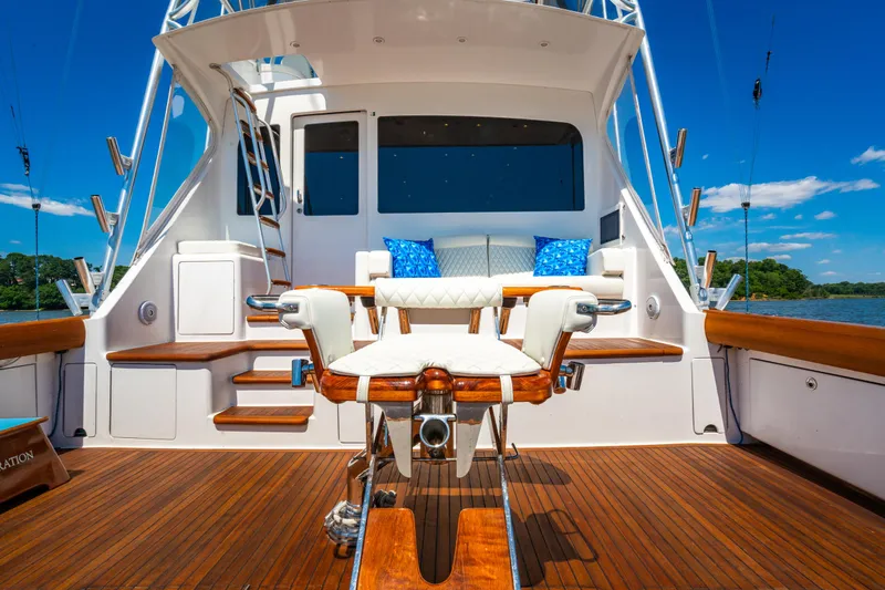 Second Generation Yacht Photos Pics Luxurious 2006 Viking 68 Convertible yacht deck with seating and fishing chair.