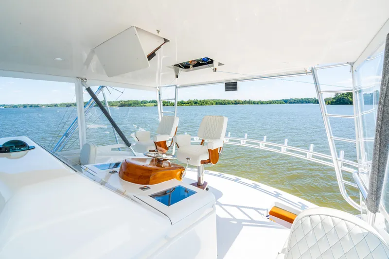 Second Generation Yacht Photos Pics Luxurious 2006 Viking 68 Convertible yacht interior with scenic water view.