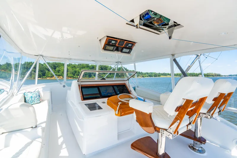 Second Generation Yacht Photos Pics Luxurious 2006 Viking 68 Convertible yacht helm with plush seating and scenic water views.