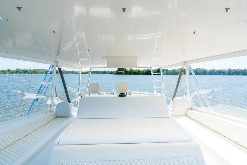 Second Generation Yacht Photos Pics Luxurious interior of 2006 Viking 68 Convertible yacht with scenic water view.