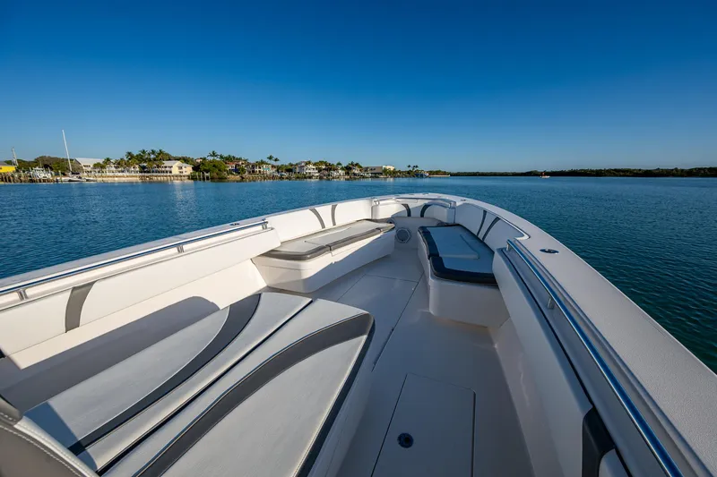 Wunderbar Yacht Photos Pics 2022 Contender 39 ST boat on calm water, featuring spacious seating and sleek design.