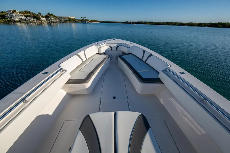 Wunderbar Yacht Photos Pics 2022 Contender 39 ST boat interior with seating, on calm water.