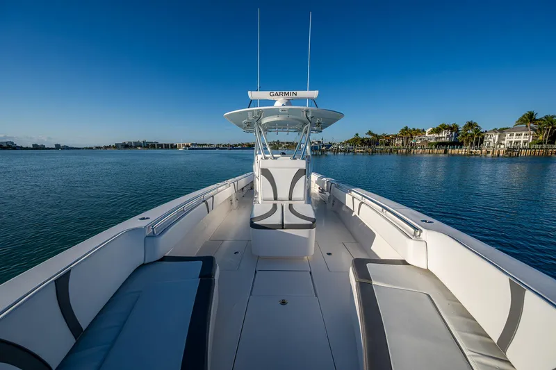 Wunderbar Yacht Photos Pics 2022 Contender 39 ST boat on calm water, clear sky, luxurious seating.