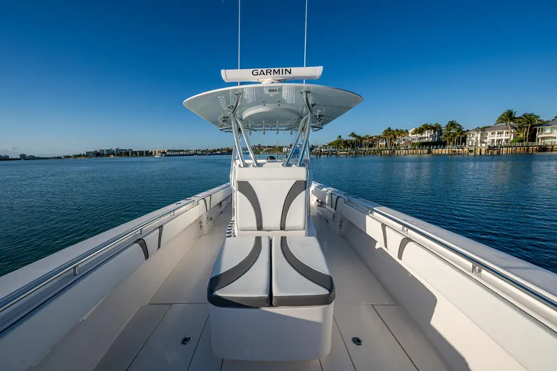 Wunderbar Yacht Photos Pics 2022 Contender 39 ST boat on calm water, featuring sleek seating and Garmin equipment.