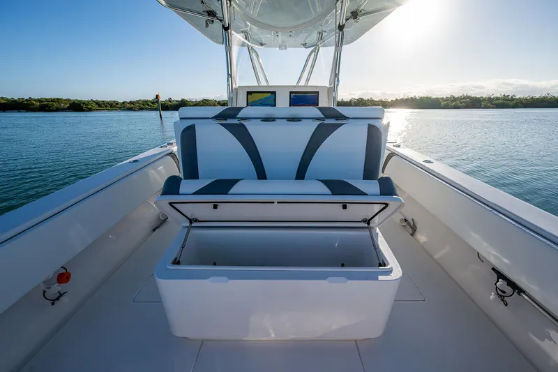 Wunderbar Yacht Photos Pics 2022 Contender 39 ST boat interior with open storage, scenic water view.