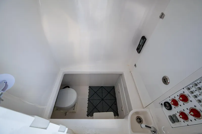 Wunderbar Yacht Photos Pics 2022 Contender 39 ST boat interior with toilet and control panel.