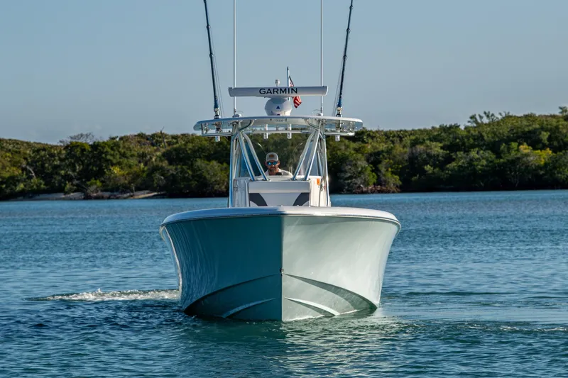 Wunderbar Yacht Photos Pics 2022 Contender 39 ST boat cruising on calm water, front view.
