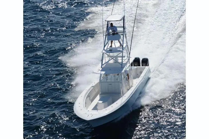  Yacht Photos Pics Manufacturer Provided Image: 2022 Invincible 42 Open Fisherman boat cruising on the ocean.