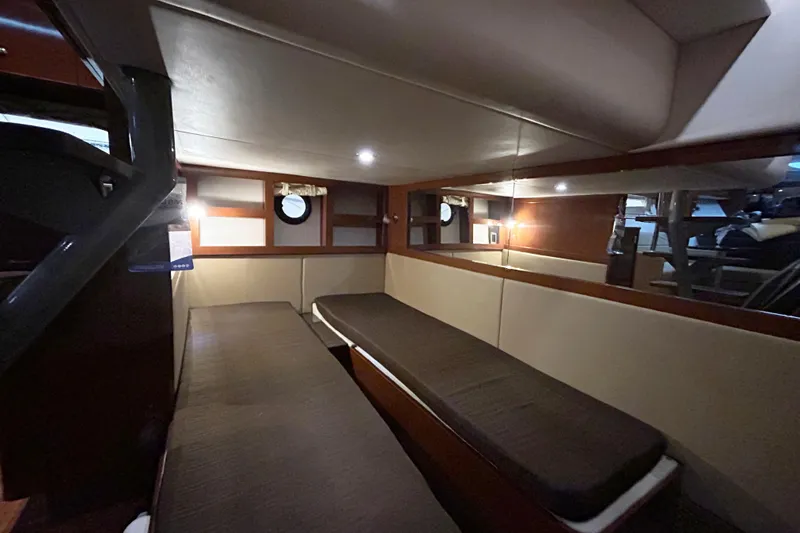  Yacht Photos Pics Interior cabin of 2014 Sea Ray 350 Sundancer with cozy seating and ambient lighting.