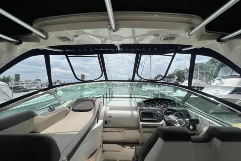  Yacht Photos Pics Interior view of 2014 Sea Ray 350 Sundancer yacht cockpit with steering and seating.