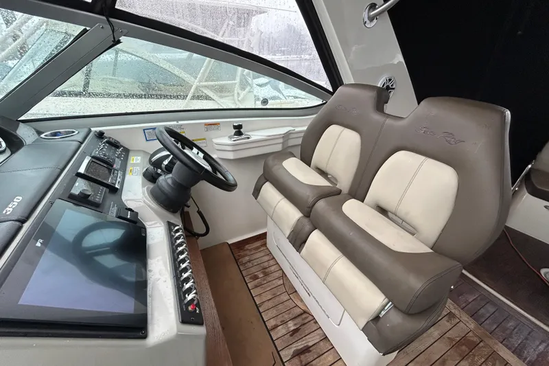  Yacht Photos Pics 2014 Sea Ray 350 Sundancer helm with dual seats and modern controls.