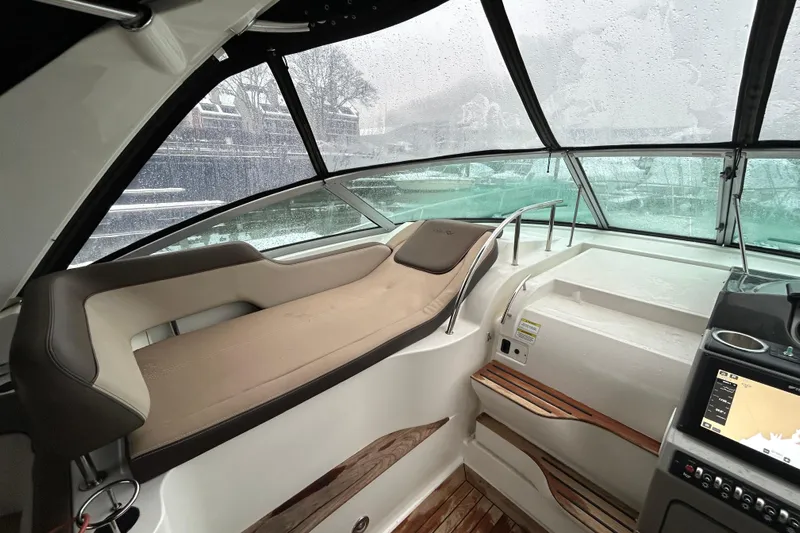  Yacht Photos Pics Interior of 2014 Sea Ray 350 Sundancer yacht with seating and navigation system.