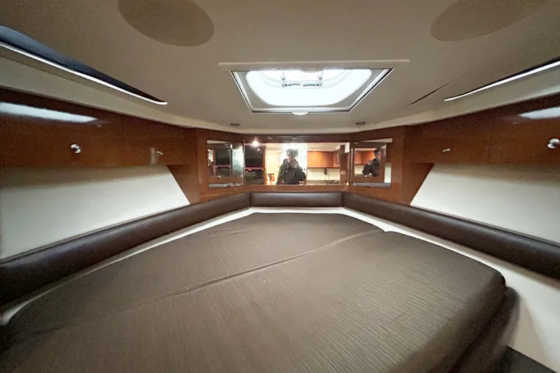  Yacht Photos Pics Luxurious interior cabin of 2014 Sea Ray 350 Sundancer yacht with skylight.