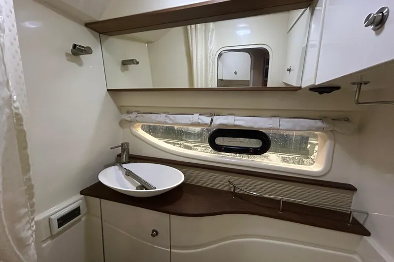 Yacht Photos Pics Luxurious bathroom interior of 2014 Sea Ray 350 Sundancer yacht with modern sink and mirror.