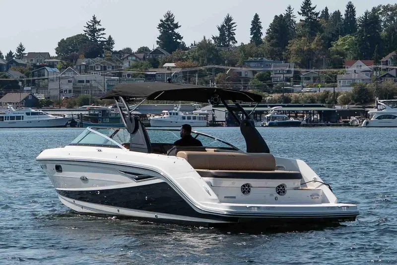  Yacht Photos Pics 2019 Sea Ray SLX 280 boat cruising on a scenic lake with waterfront homes.