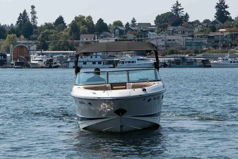  Yacht Photos Pics 2019 Sea Ray SLX 280 boat cruising on a scenic lake with houses in the background.
