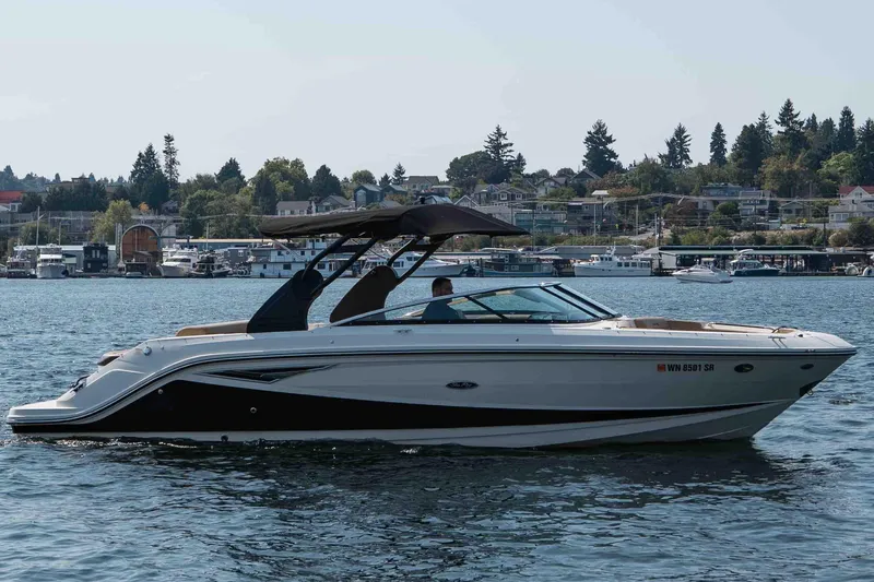  Yacht Photos Pics 2019 Sea Ray SLX 280 boat cruising on a scenic lake with a marina backdrop.