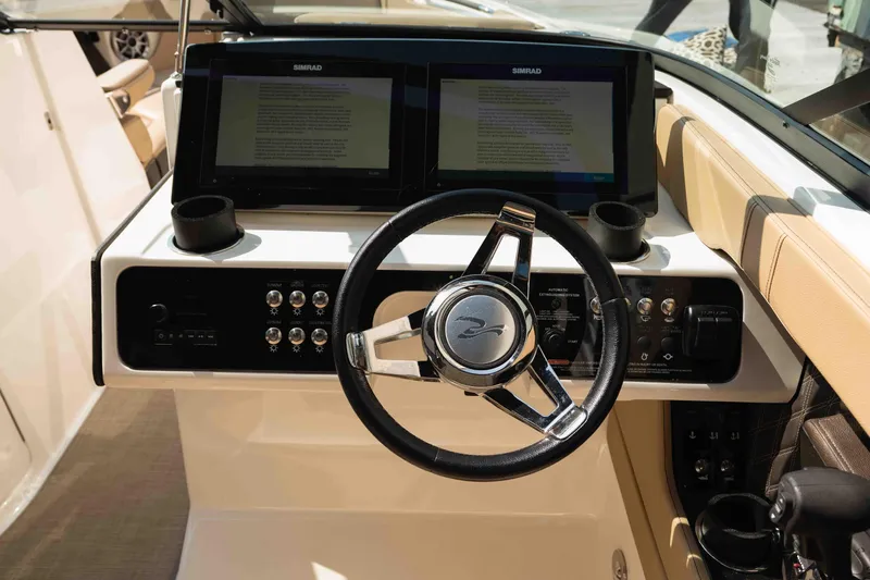  Yacht Photos Pics 2019 Sea Ray SLX 280 helm with dual Simrad displays and sleek steering wheel.