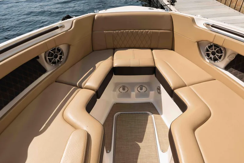  Yacht Photos Pics Luxurious seating area on a 2019 Sea Ray SLX 280 boat, featuring tan upholstery.