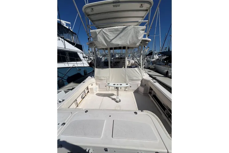 Pole Position Yacht Photos Pics 2006 Grady-White Express 330 boat docked at marina, featuring spacious deck and canopy.