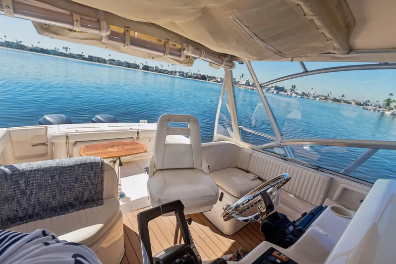 Pole Position Yacht Photos Pics Interior view of 2006 Grady-White Express 330 boat with scenic waterfront backdrop.