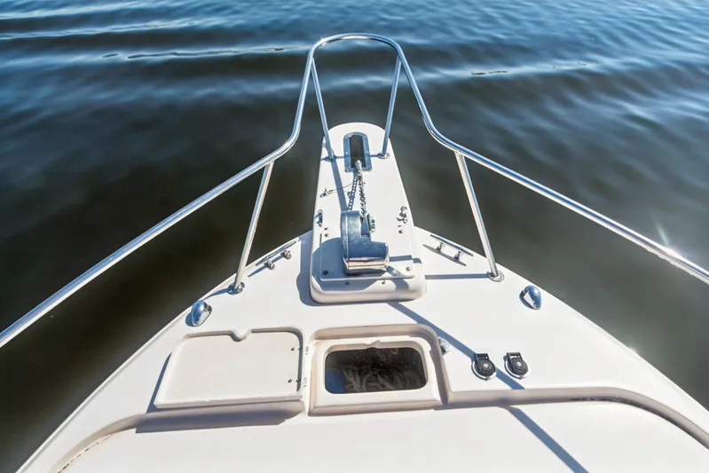 Pole Position Yacht Photos Pics Bow of 2006 Grady-White Express 330 boat on calm water.